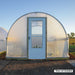 Bootstrap Farmer 10' × 12' Hobby Greenhouse shown with optional End Wall Door Frame Kit and customer-supplied door, which is not included