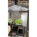 Close-up of seedlings growing inside a bronze Janco Garden Curio with condensation on the glazing