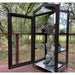 Janco Garden Curio in bronze outdoors with glass door open and adjustable plant shelves