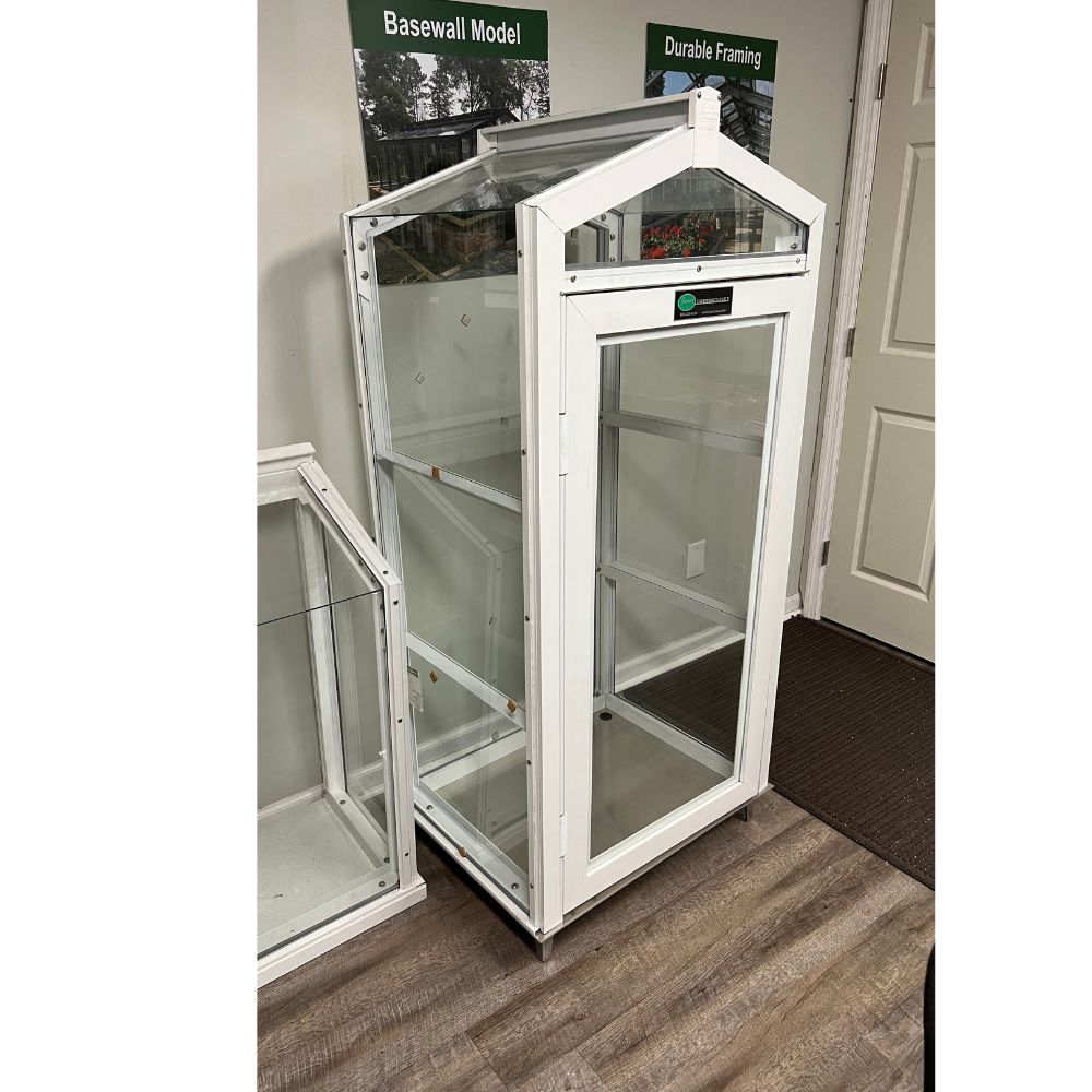 White Janco Garden Curio shown indoors at an angle with adjustable glass shelves