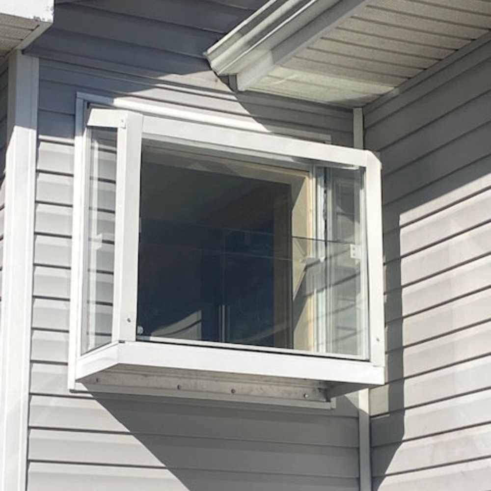 White Janco Garden Window installed on a home exterior, shown from the front