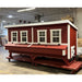 Red and white chicken coop with a raised nesting box and four windows.