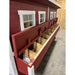 Red and white chicken coop, side view of 10 nesting boxes with door open.