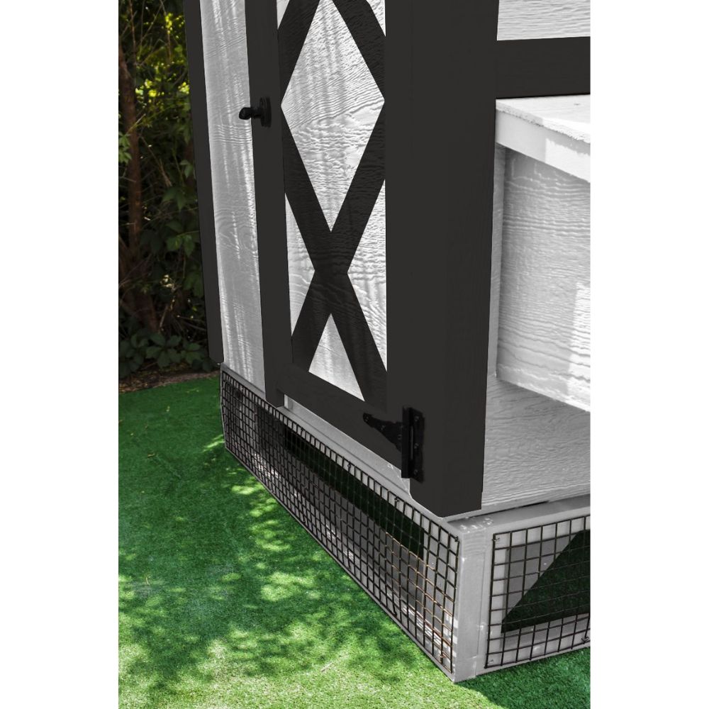 Close-up of the corner of a chicken coop elevated on wooden panels with black wire mesh.