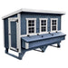 Blue and white chicken coop with three windows, a nesting box, and a large access door.