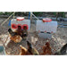 Chicken feeder and waterer side-by-side with 8 chickens in a coop.