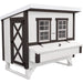 White chicken coop with black trim and two windows on a white background.
