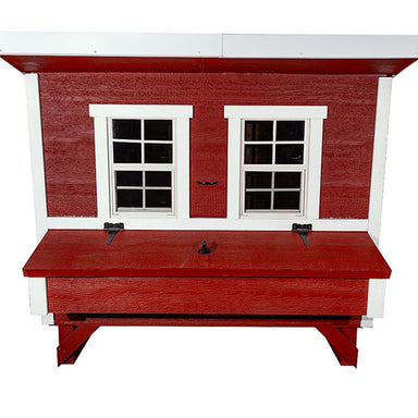 A red wooden chicken coop with white trim, featuring two small window-style doors and a front nesting box.