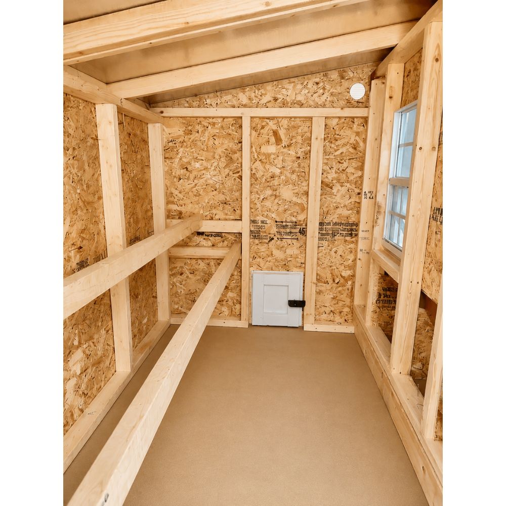 Chicken Coop interior with two roosts on the left and nesting box openings on the right.