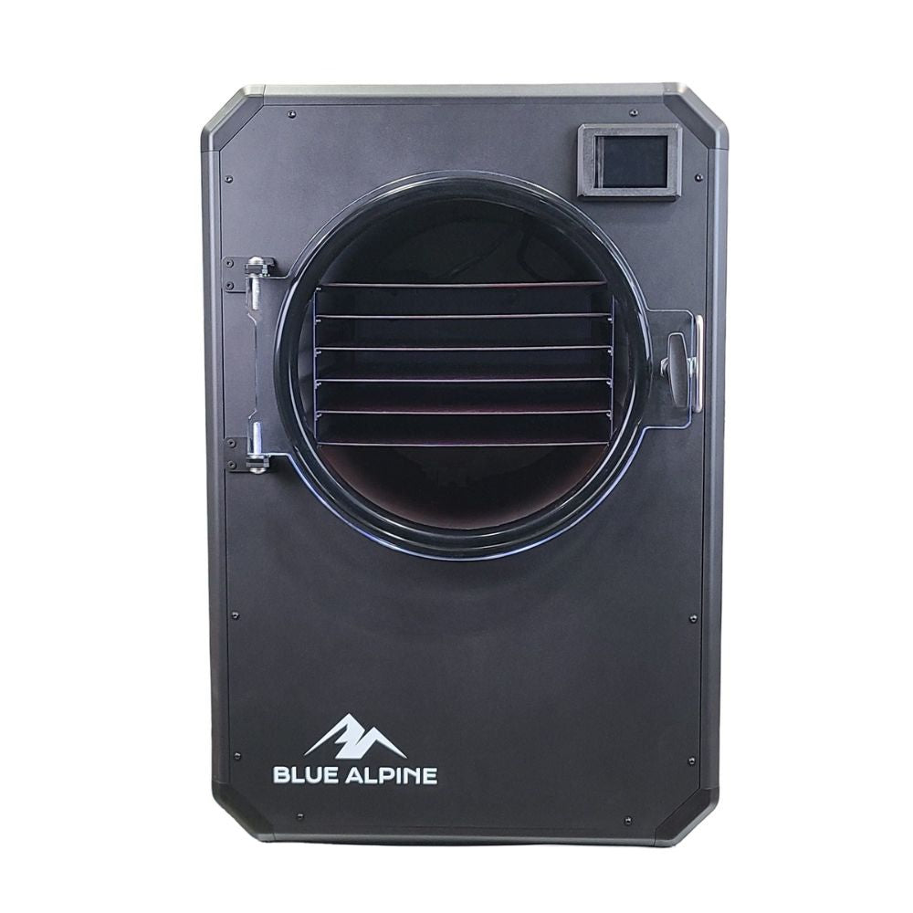 Large Elite freeze dryer by Blue Alpine, featuring a flat black front panel with a circular transparent door, black interior racks, and a small digital display screen in the upper right corner.