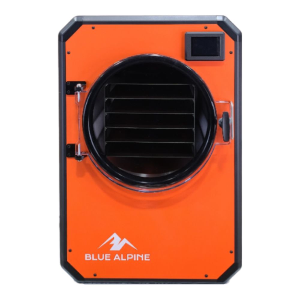Large Elite freeze dryer by Blue Alpine, featuring a bright orange front panel with a circular transparent door, black interior racks, and a small digital display screen in the upper right corner.