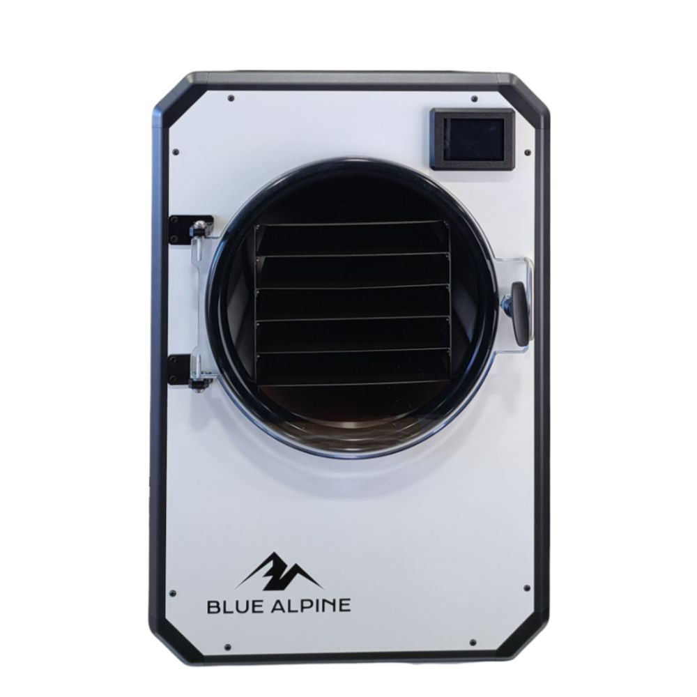 Medium Elite freeze dryer by Blue Alpine, featuring a bright white front panel with a circular transparent door, black interior racks, and a small digital display screen in the upper right corner.
