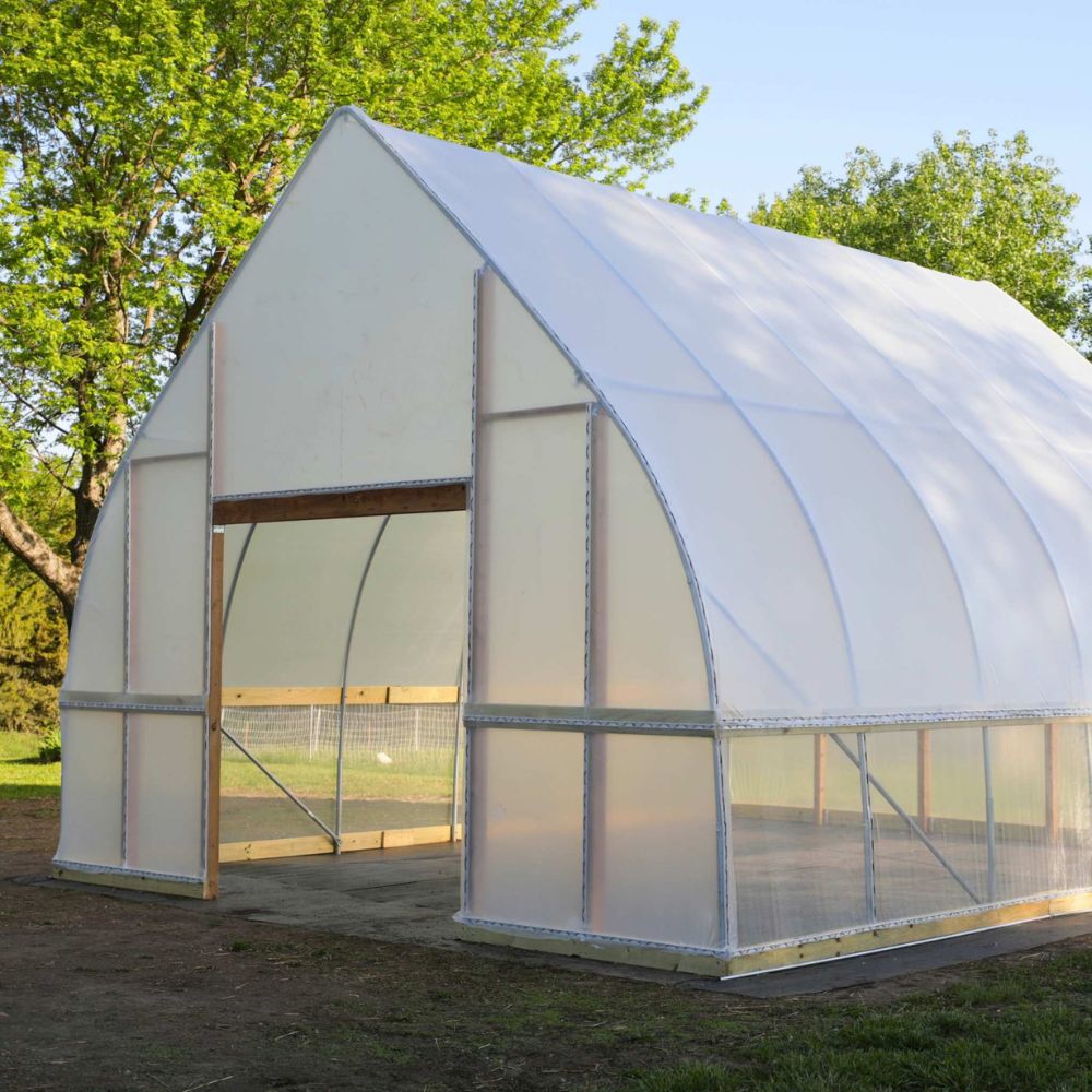 Front and side view of the completed Bootstrap Farmer DIY Gothic Greenhouse showing the peaked Gothic roof and greenhouse entrance