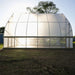Full side view of the completed Bootstrap Farmer DIY Gothic Greenhouse showing the greenhouse covering and tall Gothic arch profile