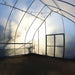 Inside angle showing double doors of the Bootstrap Farmer Gothic High Tunnel.