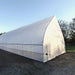 Left side of the Bootstrap Farmer Gothic High Tunnel showing roll up kit and double doors.