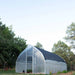 Bootstrap Farmer Gothic High Tunnel with an open door and optional shade cloth.