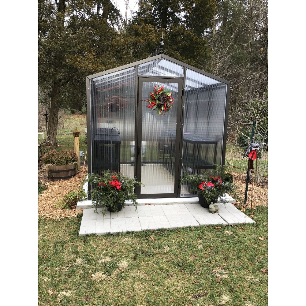 Front view of Janco Palmetto 8' x 10' greenhouse with bronze frame and polycarbonate panels