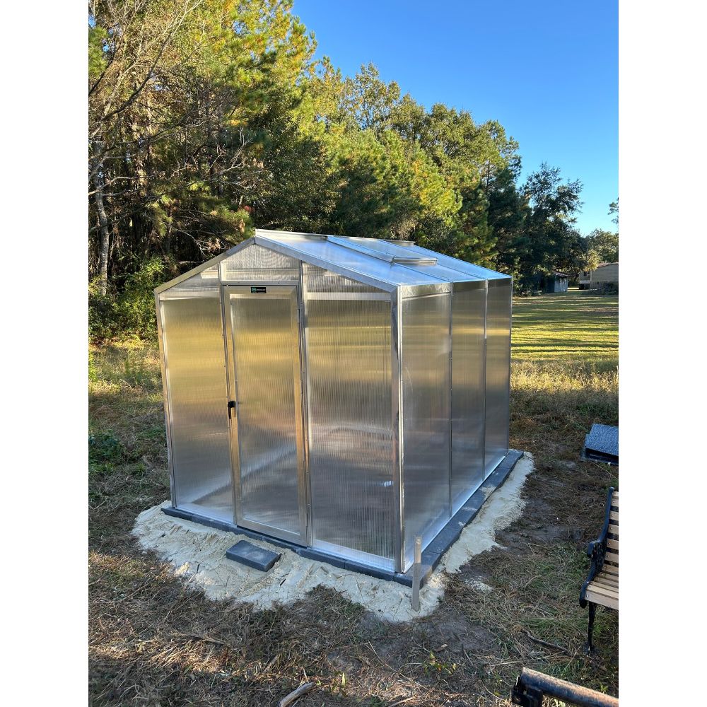 Rear and side view of Janco Palmetto 8' x 10' greenhouse with polycarbonate panels