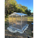 Rear and side view of Janco Palmetto 8' x 10' greenhouse with polycarbonate panels