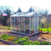 Janco Palmetto 8' x 10' white glass greenhouse with ridge vent open and interior shade cloth