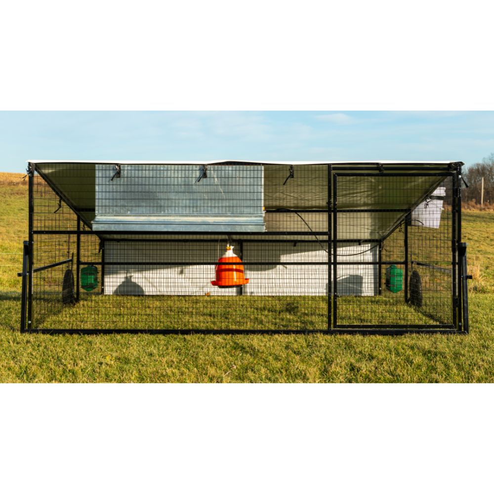 Front view of Porta Coop 10' x 12' Haven mobile chicken coop with bell waterer and feeders