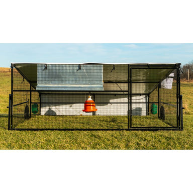 Front view of Porta Coop 10' x 12' Haven mobile chicken coop with bell waterer and feeders