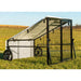 Side view of Porta Coop 4' × 5' Haven mobile chicken coop with wire frame, tarp roof, and wheels