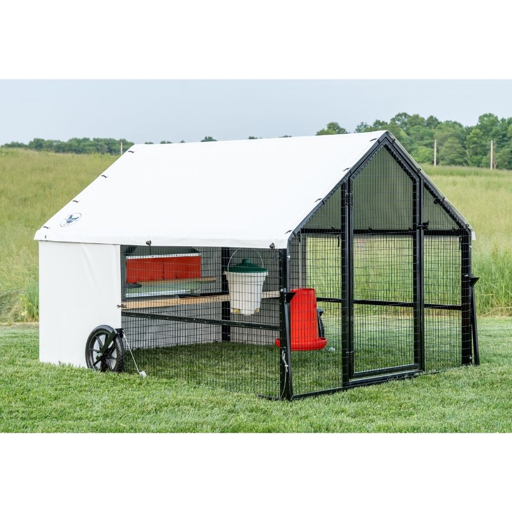 Porta Coop 6' x 8' Heritage mobile chicken coop shown with feeder, waterer and nest box